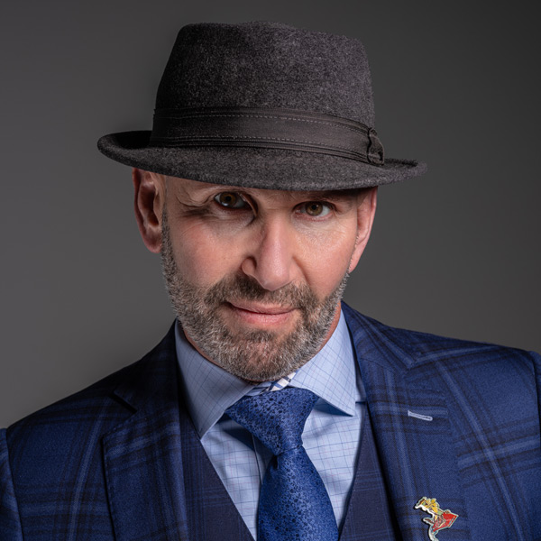 Mitchell A. Greenberg wearing a fedora